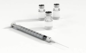a syringe and injection bottles