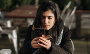 using phone while holding credit card